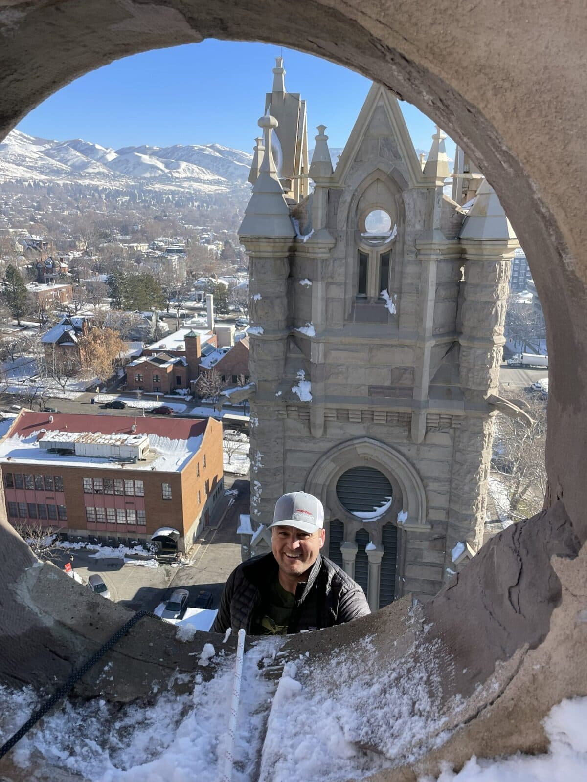 Utah Wildlife Specialists technician in the spire of the Cathedral of the Madeleine above Salt Lake City