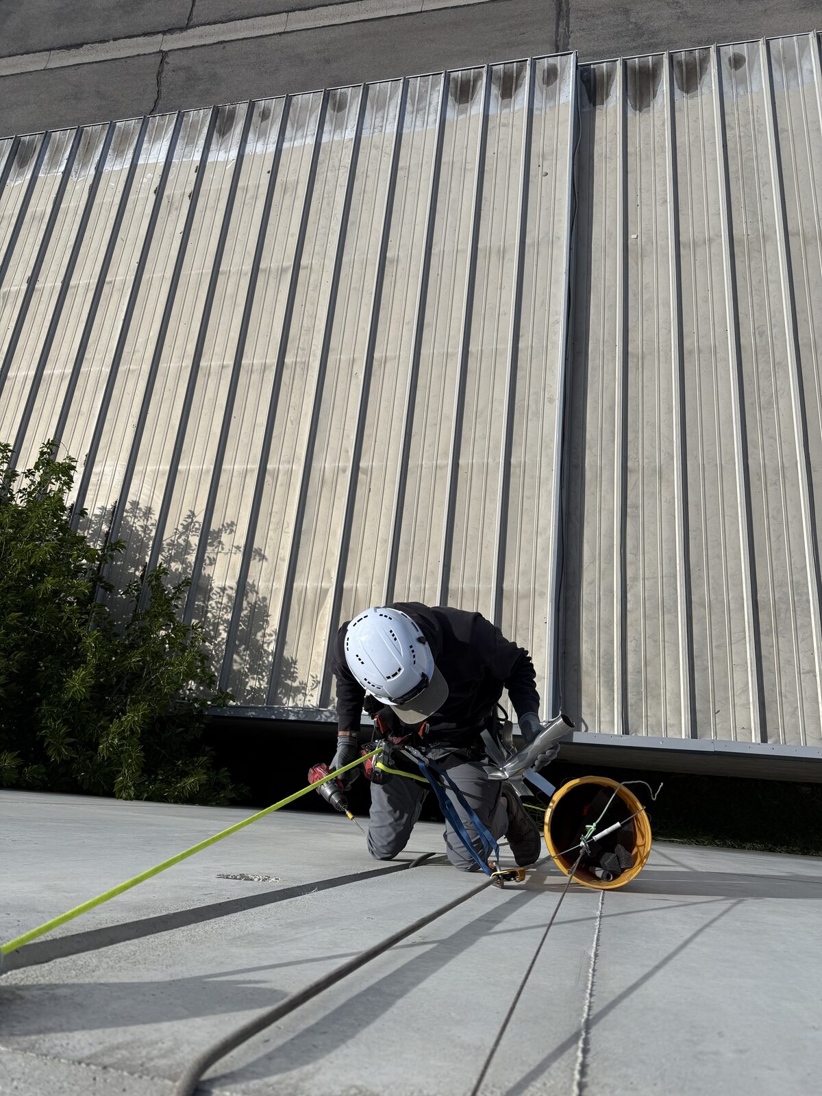 Technician preparing tools for an upper-story exclusion
